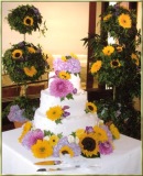 Lavender and yellow wedding cake and decor