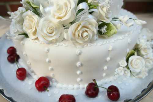 White wedding cake with perfect red accents