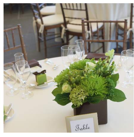 Green, white and brown wedding tables