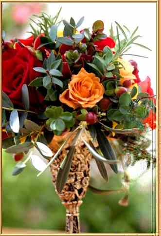 Red and orange roses with berries